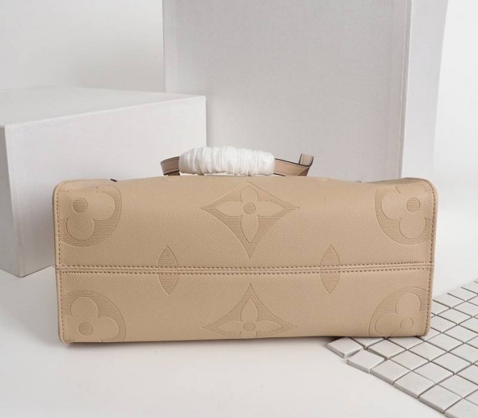 L0vis Vvtt0n Monogram Empreinte Giant Onthego MM Bag In Beige