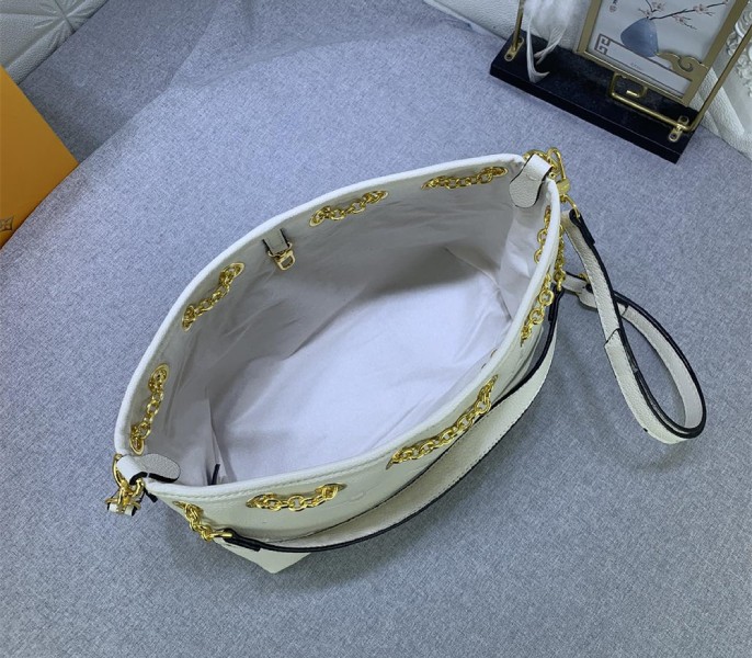 L0vis Vvtt0n Monogram Empreinte Leather Bundle Bag In Cream