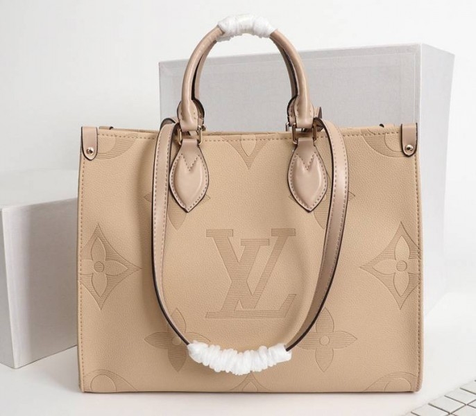 L0vis Vvtt0n Monogram Empreinte Giant Onthego MM Bag In Beige