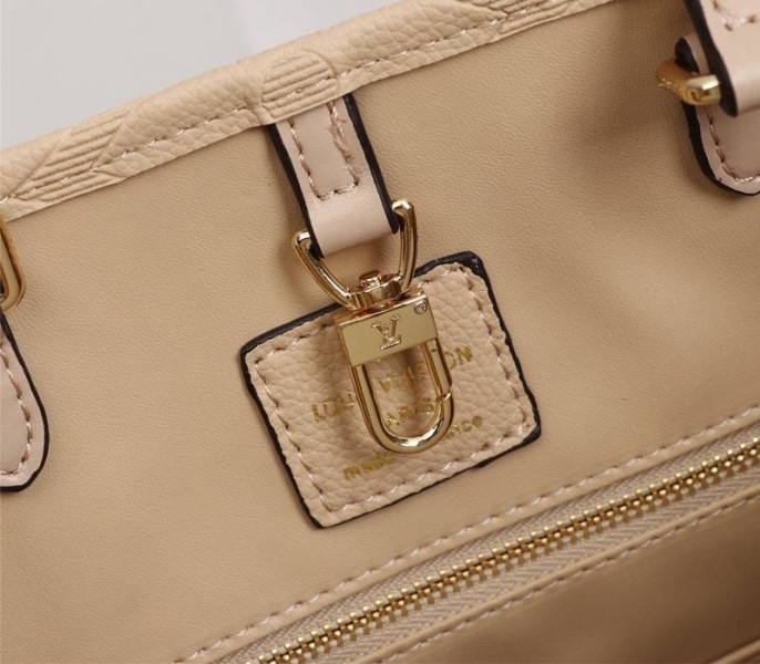 L0vis Vvtt0n Monogram Empreinte Giant Onthego MM Bag In Beige