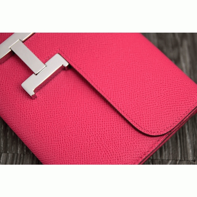 Peach knockoff H**me5 Constance wallet