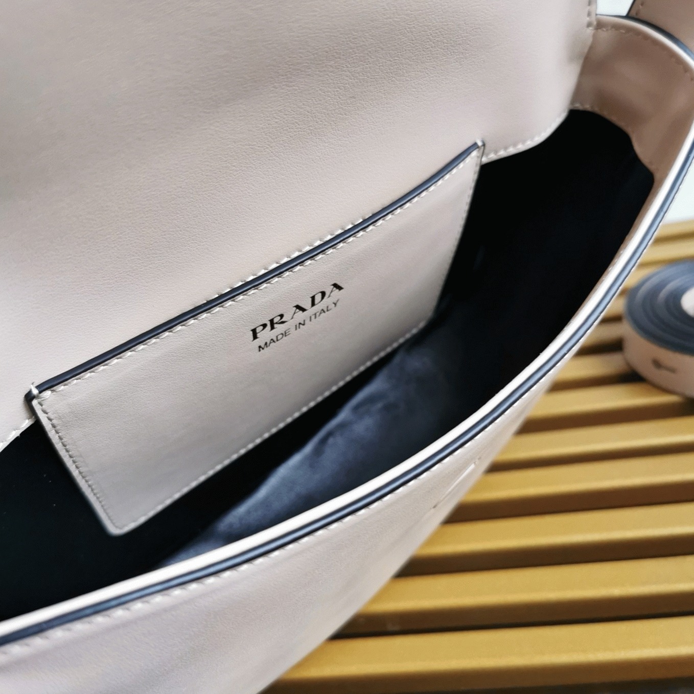 Pra*a Arque Shoulder Bag with Flap Replica in Beige