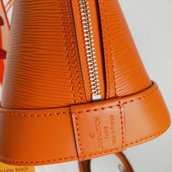 L0vis Vvtt0n Epi Leather Alma PM Handbag In Orange With Jacquard Strap